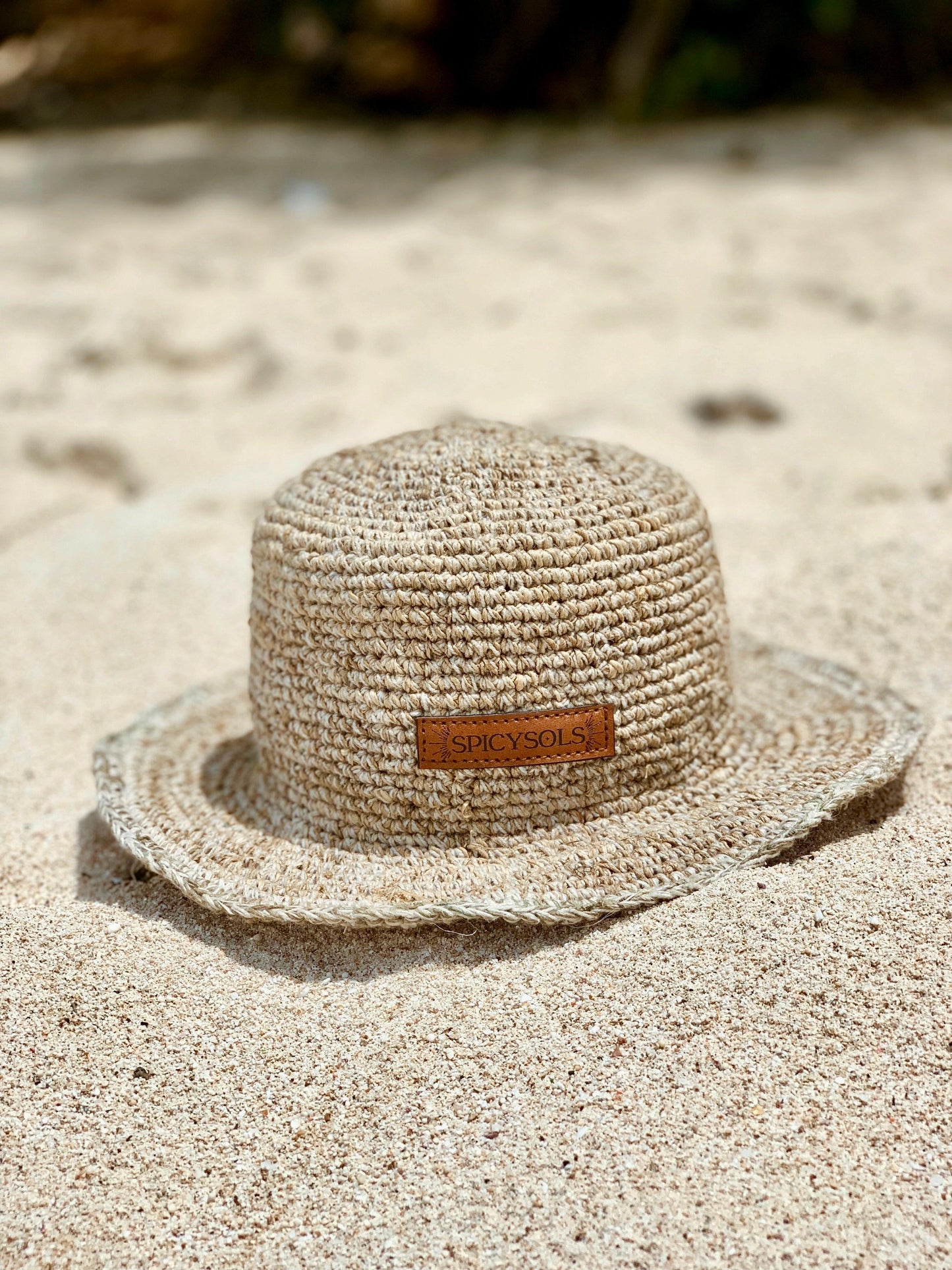 Sustainable sun hat on sandy beach Australia
