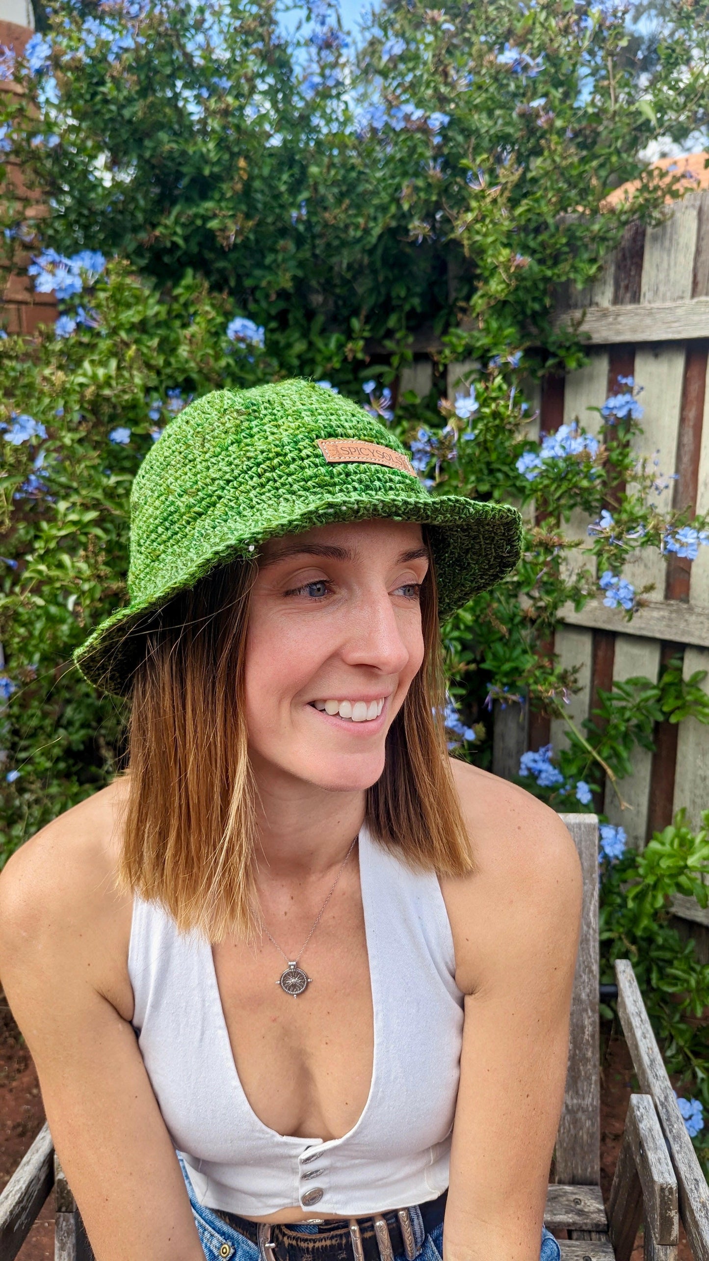 Woman smiling wearing eco-friendly bucket hat