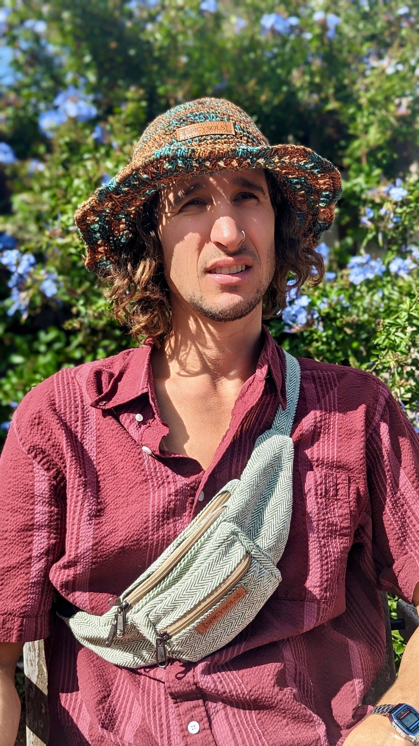 Man wearing hemp hat with vegan leather label sustainable bum bag across his body