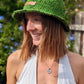 Woman smiling wearing eco-friendly bucket hat