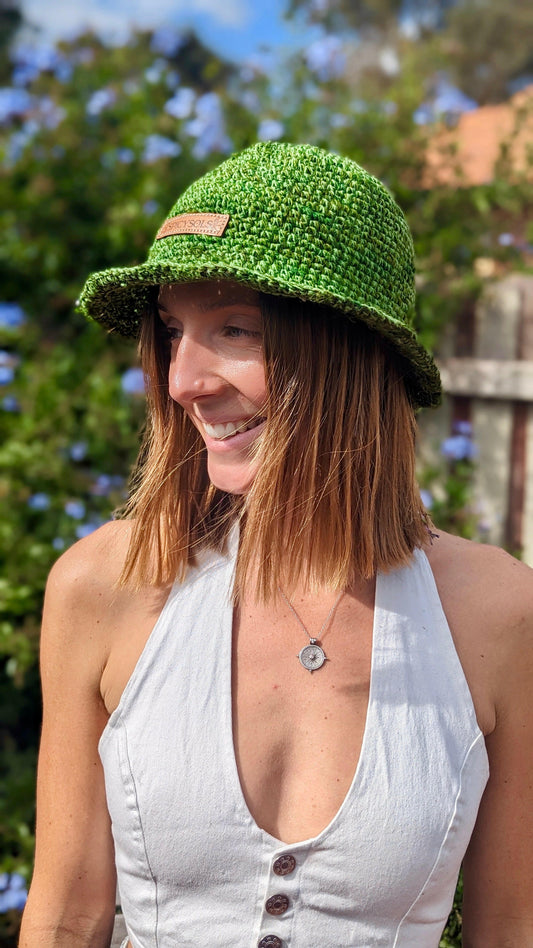 Woman smiling wearing eco-friendly bucket hat